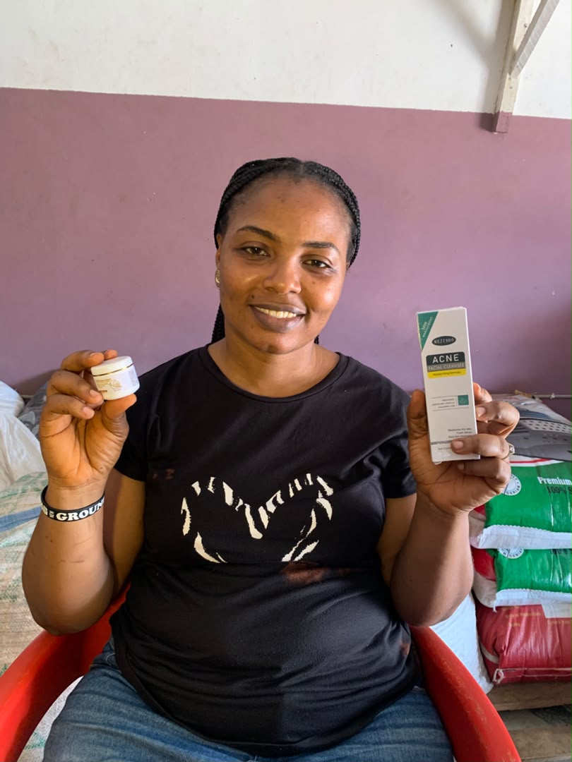 Customer holding Snail face cream and Face Wash