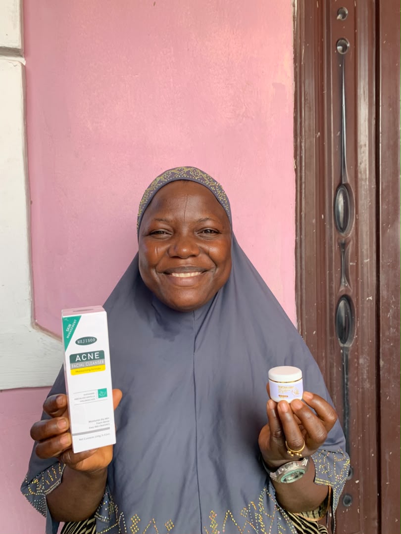 Customer holding Snail Face Cream and Face Wash