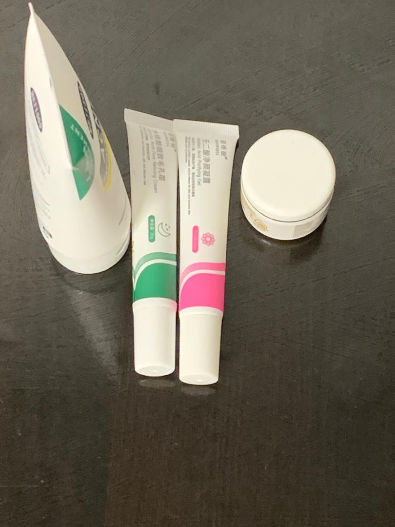 Customer holding Snail Face Cream and Face Wash